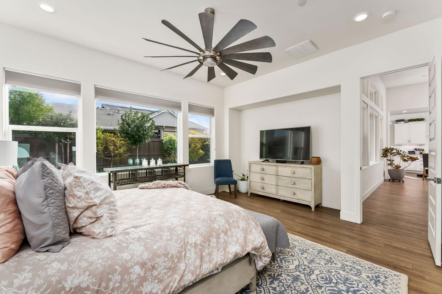 1509 Harvest Loop Folsom, CA 95630 - Photo 52 of 92 THE PRIMARY ENSUITE is only rivaled by it Junior Primary Ensuite. What they both have in common, they are both on the ground floor. That is almost impossible to find! No more stairs just to go to bed, lol. It's true, hard to appreciate until you have it, and sorely missed when you do not. Flood with natural light, and overlooking the rear yards and gardens of the lanai.