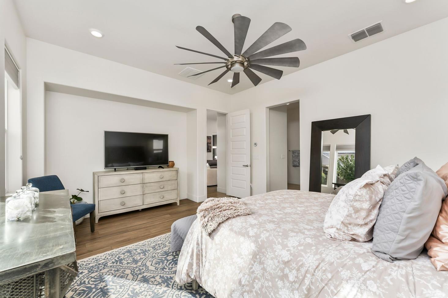 1509 Harvest Loop Folsom, CA 95630 - Photo 53 of 92 THE PRIMARY ENSUITE is only rivaled by it Junior Primary Ensuite. What they both have in common, they are both on the ground floor. That is almost impossible to find! No more stairs just to go to bed, lol. It's true, hard to appreciate until you have it, and sorely missed when you do not. Flood with natural light, and overlooking the rear yards and gardens of the lanai.