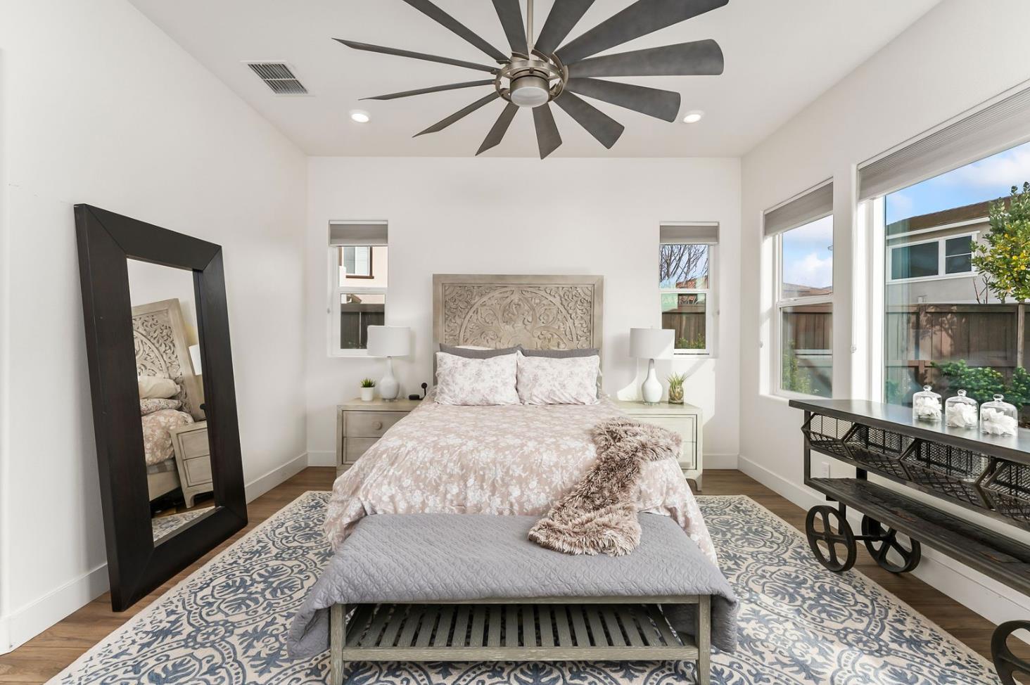 1509 Harvest Loop Folsom, CA 95630 - Photo 54 of 92 THE PRIMARY ENSUITE is only rivaled by it Junior Primary Ensuite. What they both have in common, they are both on the ground floor. That is almost impossible to find! No more stairs just to go to bed, lol. It's true, hard to appreciate until you have it, and sorely missed when you do not. Flood with natural light, and overlooking the rear yards and gardens of the lanai.