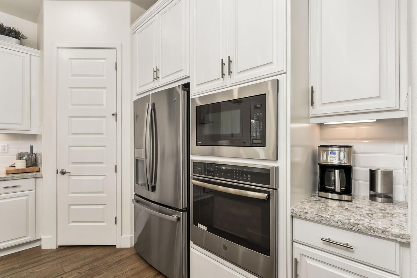 1509 Harvest Loop Folsom, CA 95630 - Photo 6 of 92 IN THE TRADITION OF HARMONIOUS DESIGN, THE GOURMET CHEF KITCHEN meets three criteria, it is magnificent, comfortable and super functional. The height of design, this kitchen meets all three criteria beautifully. The emphasis might appear to be more on form trumps function, when in reality is it the epitome of form follows function! But do not be deceived, this picture perfect kitchen is deceptively hard working. With the extended cabinetry into the breakfast room, to the upgraded designer stainless steel appliances and sleek and sophisticated quartz slab counters. This kitchen is elegant with casual comfort -- creating an environment that will surely be a favorite gathering spot for generations. Please do not miss the large walk in doored pantry!