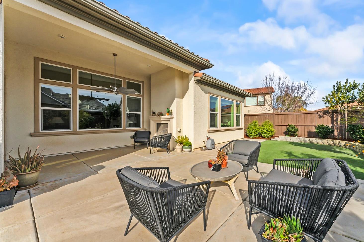 1509 Harvest Loop Folsom, CA 95630 - Photo 64 of 92 OUTDOOR ENTERTAINING NEVER LOOKS SO INVITING! The adjacent outdoor leisure and dining room enjoy a wonderful fireplace which adds charm and enhances endless outdoor enjoyment. This majestic rear elevation - spacious, stately and suggestive of a vacation estate home. Find a seat and enjoy an morning or afternoon views of the fauna and flora of the beautiful grounds and gardens.