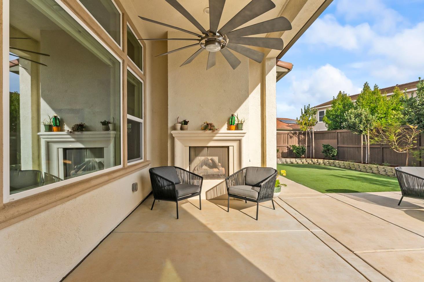 1509 Harvest Loop Folsom, CA 95630 - Photo 65 of 92 OUTDOOR ENTERTAINING NEVER LOOKS SO INVITING! The adjacent outdoor leisure and dining room enjoy a wonderful fireplace which adds charm and enhances endless outdoor enjoyment. This majestic rear elevation - spacious, stately and suggestive of a vacation estate home. Find a seat and enjoy an morning or afternoon views of the fauna and flora of the beautiful grounds and gardens.