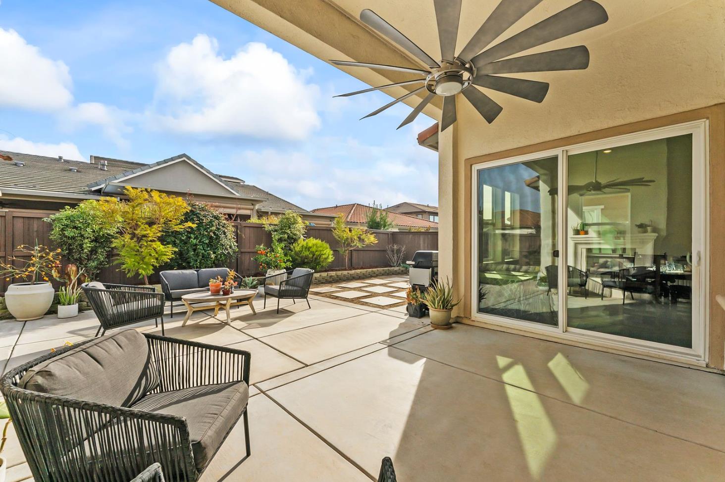 1509 Harvest Loop Folsom, CA 95630 - Photo 66 of 92 OUTDOOR ENTERTAINING NEVER LOOKS SO INVITING! The adjacent outdoor leisure and dining room enjoy a wonderful fireplace which adds charm and enhances endless outdoor enjoyment. This majestic rear elevation - spacious, stately and suggestive of a vacation estate home. Find a seat and enjoy an morning or afternoon views of the fauna and flora of the beautiful grounds and gardens.