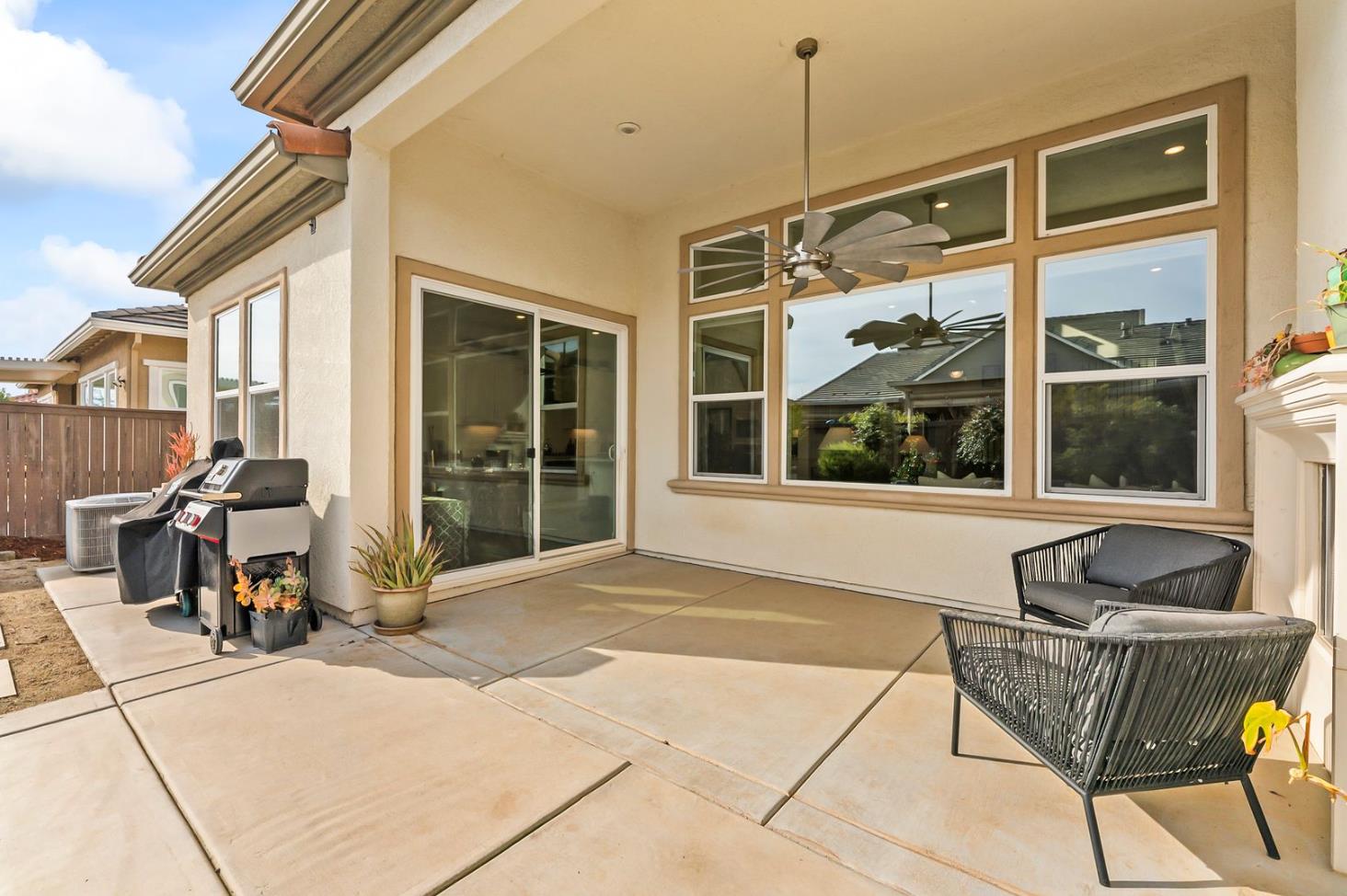 1509 Harvest Loop Folsom, CA 95630 - Photo 68 of 92 OUTDOOR ENTERTAINING NEVER LOOKS SO INVITING! The adjacent outdoor leisure and dining room enjoy a wonderful fireplace which adds charm and enhances endless outdoor enjoyment. This majestic rear elevation - spacious, stately and suggestive of a vacation estate home. Find a seat and enjoy an morning or afternoon views of the fauna and flora of the beautiful grounds and gardens.