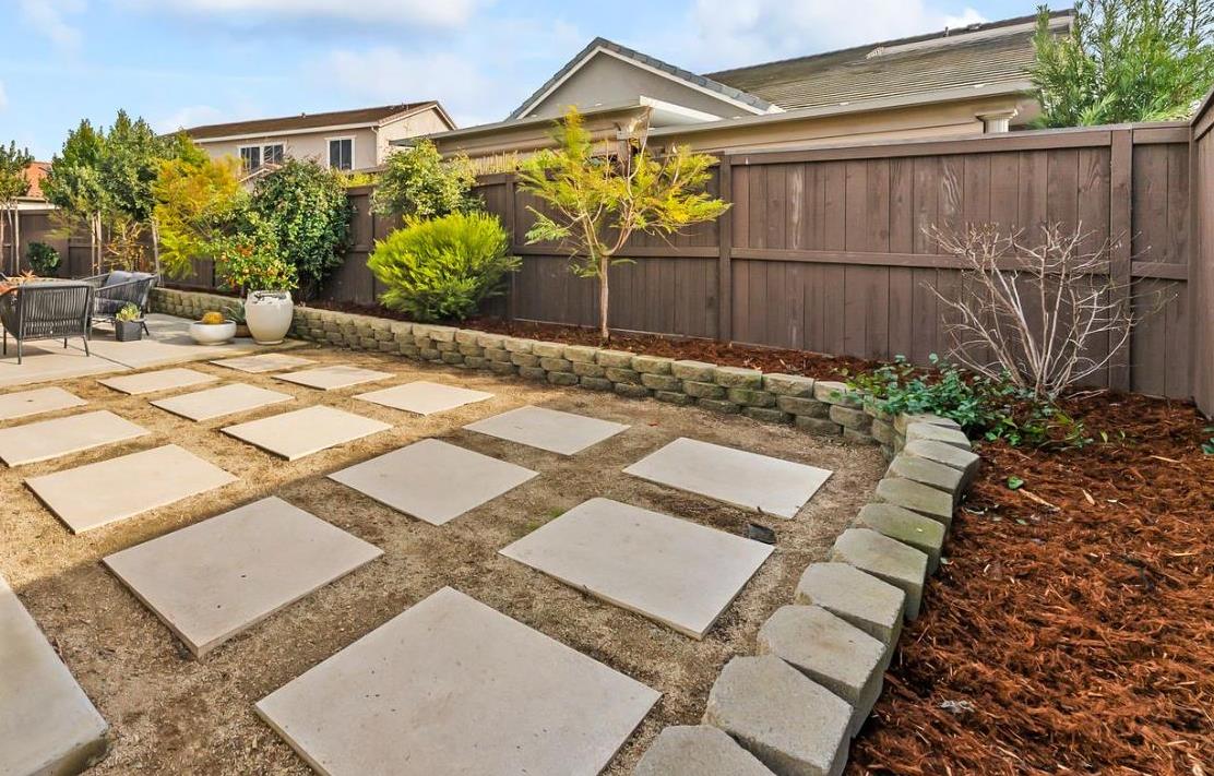 1509 Harvest Loop Folsom, CA 95630 - Photo 70 of 92 OUTDOOR ENTERTAINING NEVER LOOKS SO INVITING! The adjacent outdoor leisure and dining room enjoy a wonderful fireplace which adds charm and enhances endless outdoor enjoyment. This majestic rear elevation - spacious, stately and suggestive of a vacation estate home. Find a seat and enjoy an morning or afternoon views of the fauna and flora of the beautiful grounds and gardens.