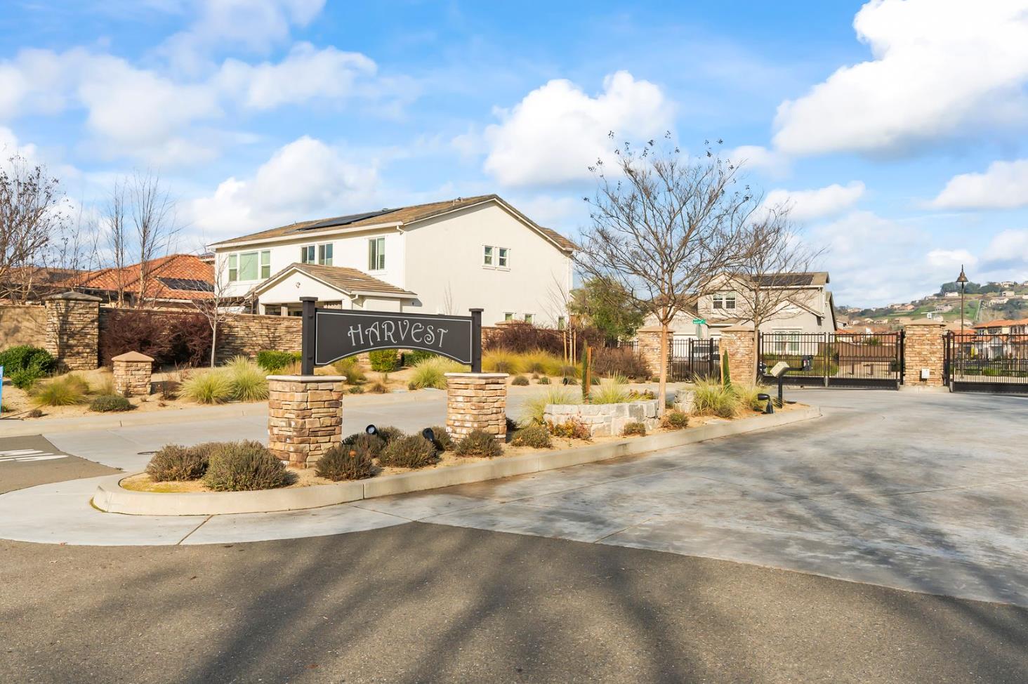 1509 Harvest Loop Folsom, CA 95630 - Photo 7 of 92 HARVEST WELCOMES YOU IN STYLE! Enjoy this super long and wide double gate entry car court. Once you enter the enclave you will enjoy open green space and a roomy community that is well planned. It is what you have been waiting for, but it sold out almost immediately after opening. You can consider this you second chance to own THE ULTIMATE DREAM HOME!
