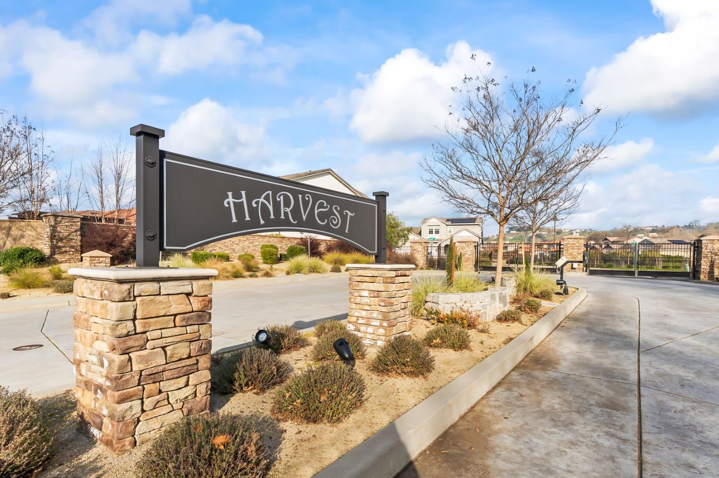 1509 Harvest Loop Folsom, CA 95630 - Photo 8 of 92 HARVEST WELCOMES YOU IN STYLE! Enjoy this super long and wide double gate entry car court. Once you enter the enclave you will enjoy open green space and a roomy community that is well planned. It is what you have been waiting for, but it sold out almost immediately after opening. You can consider this you second chance to own THE ULTIMATE DREAM HOME!