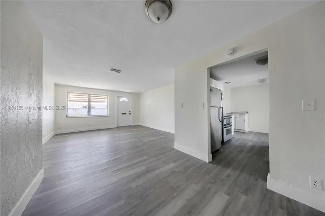 a view of entryway with wooden floor