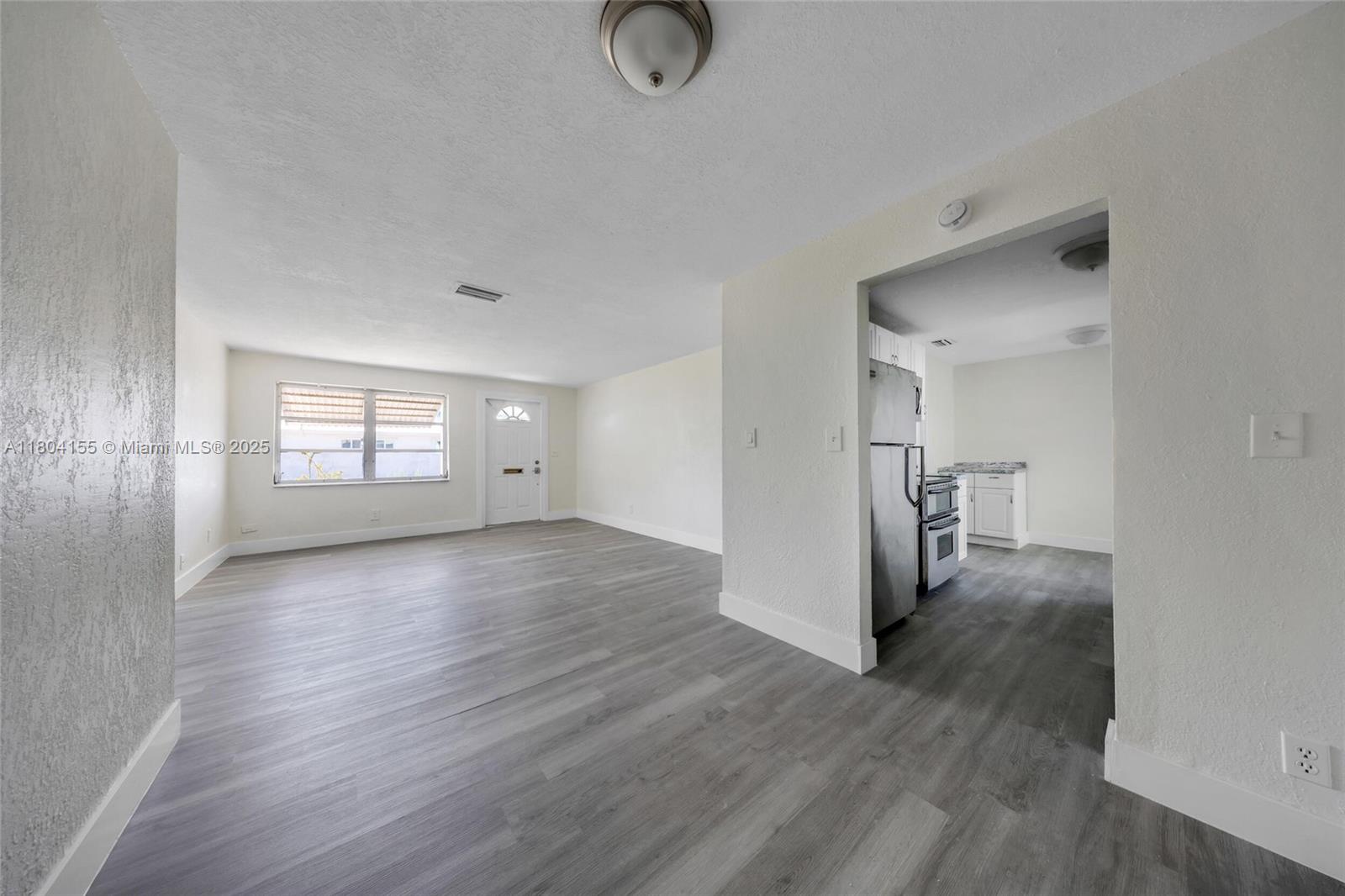 2520 Northwest 2nd Drive Pompano Beach, FL 33064 - Photo 6 of 20 a view of entryway with wooden floor