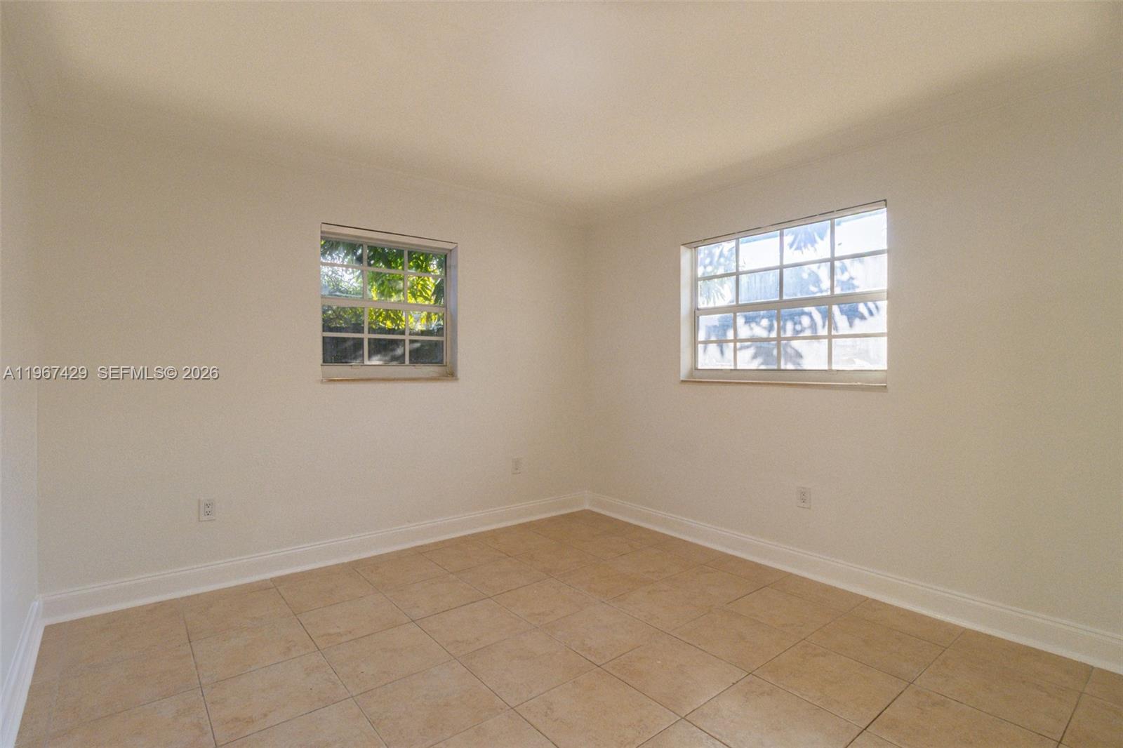 1518 Northwest 65th Street Miami, FL 33147 - Photo 13 of 28 an empty room with windows