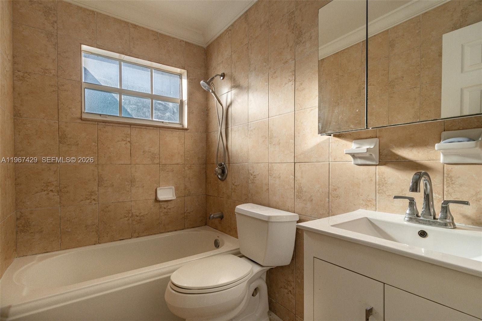 1518 Northwest 65th Street Miami, FL 33147 - Photo 15 of 28 a bathroom with a sink toilet and shower