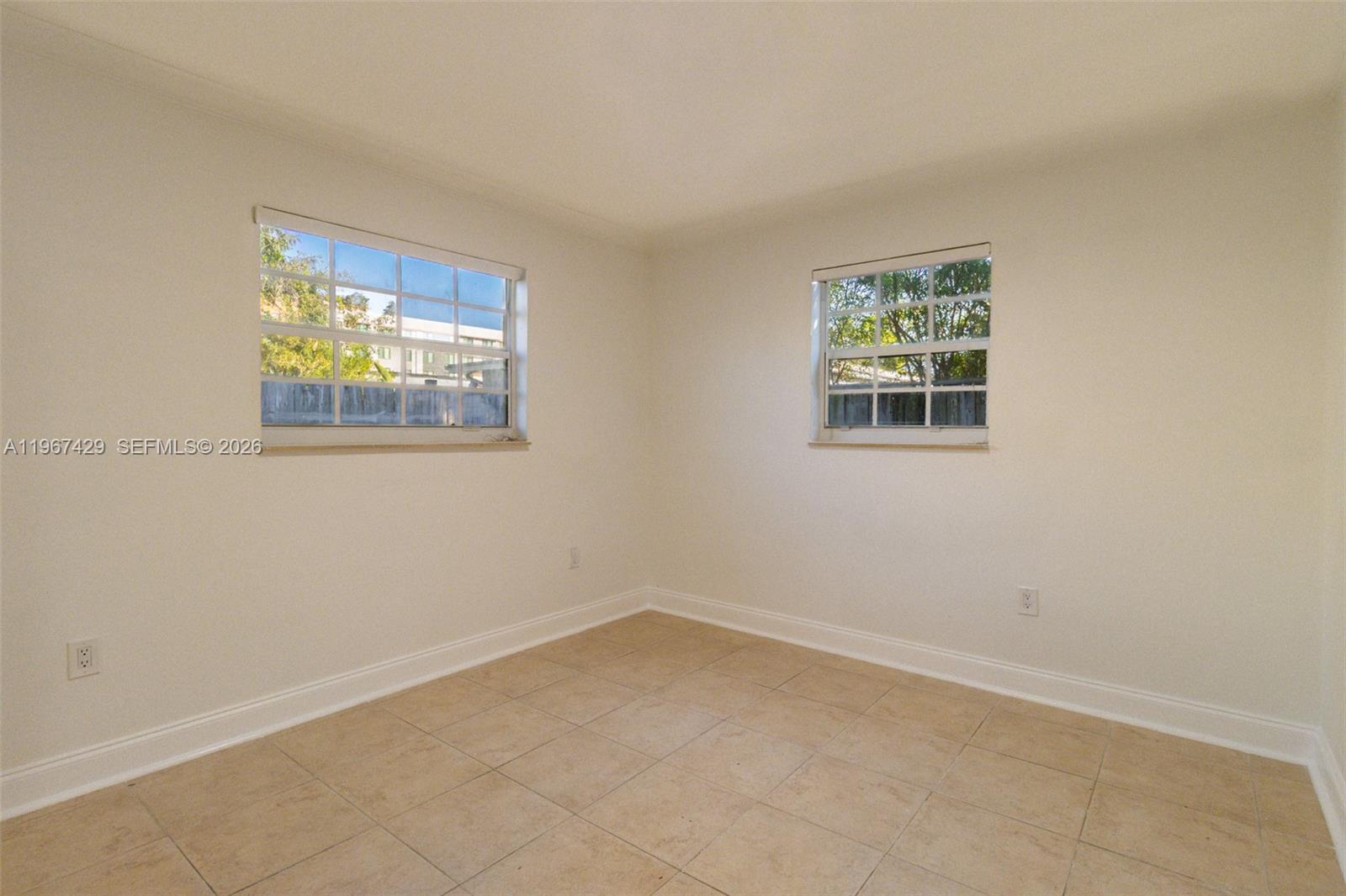 1518 Northwest 65th Street Miami, FL 33147 - Photo 16 of 28 an empty room with windows