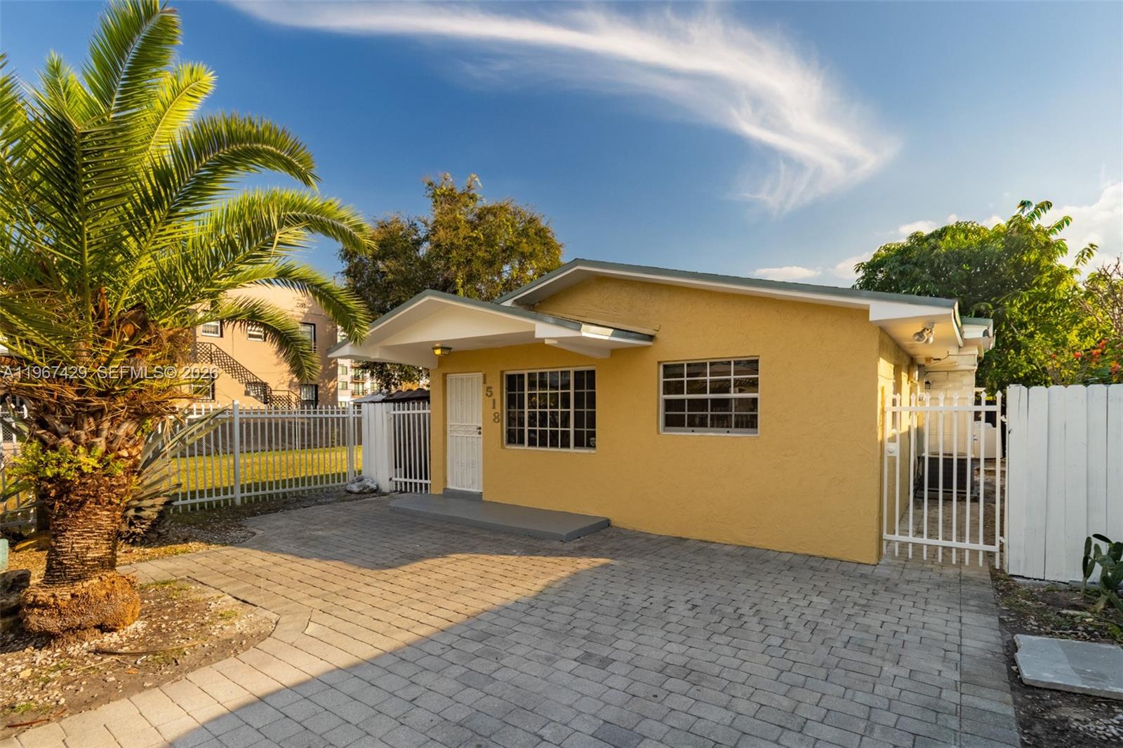 1518 Northwest 65th Street Miami, FL 33147 - Photo 2 of 28 a view of a house with a yard