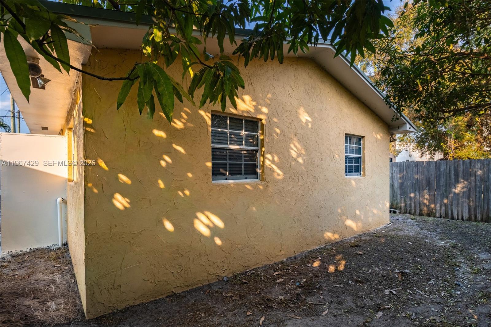 1518 Northwest 65th Street Miami, FL 33147 - Photo 22 of 28 a backyard of a house