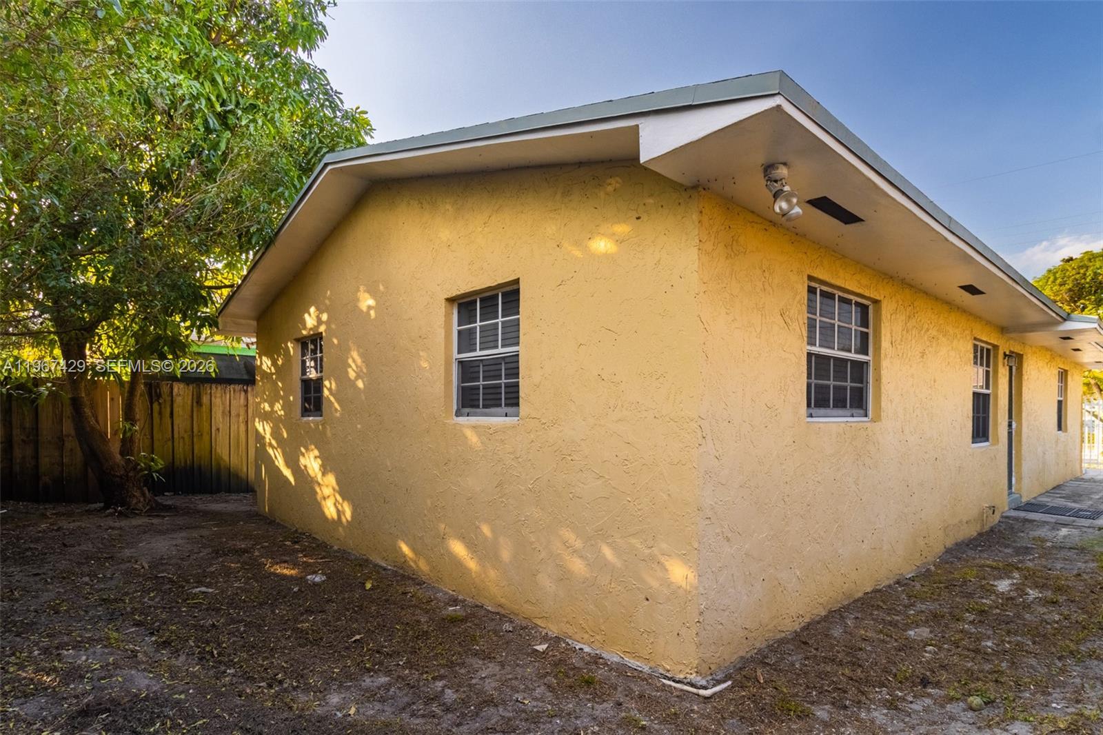 1518 Northwest 65th Street Miami, FL 33147 - Photo 23 of 28 a backyard of a house