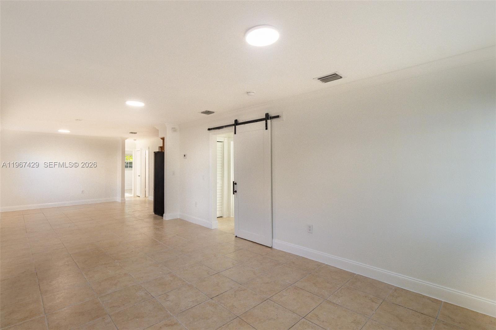 1518 Northwest 65th Street Miami, FL 33147 - Photo 5 of 28 a view of an empty room