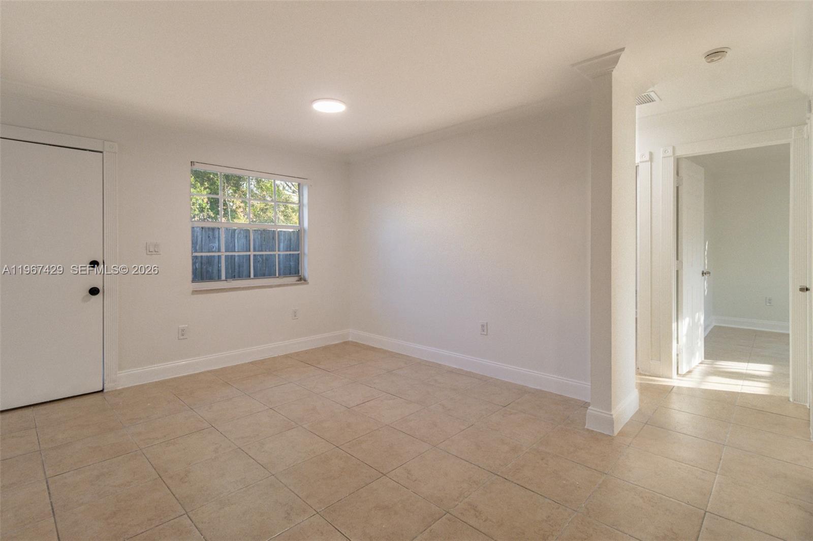 1518 Northwest 65th Street Miami, FL 33147 - Photo 8 of 28 an empty room with windows and closet