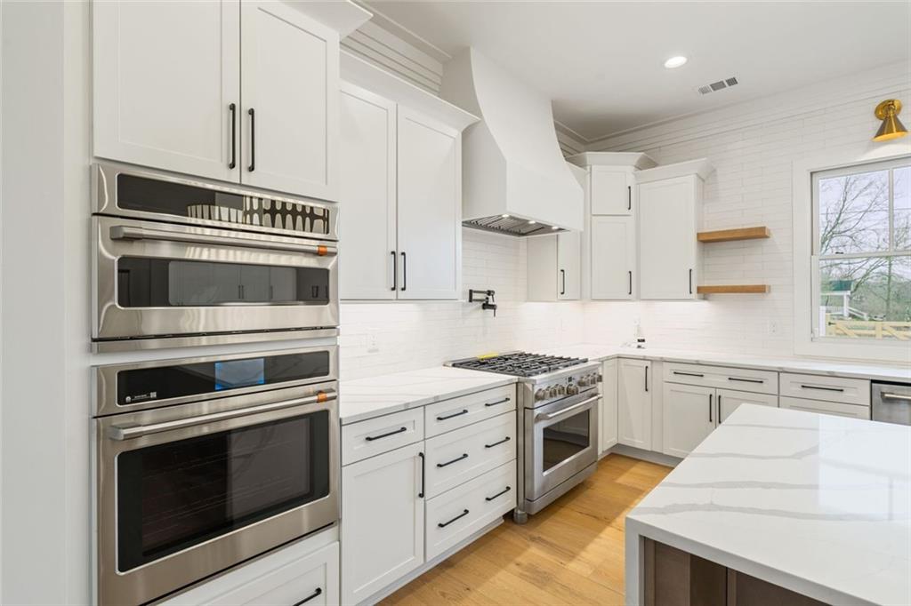 555 Lower Birmingham Road Canton, GA 30115 - Photo 51 of 104 a kitchen with cabinets stainless steel appliances and sink