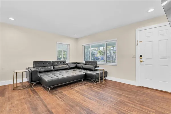 a living room with furniture and a window