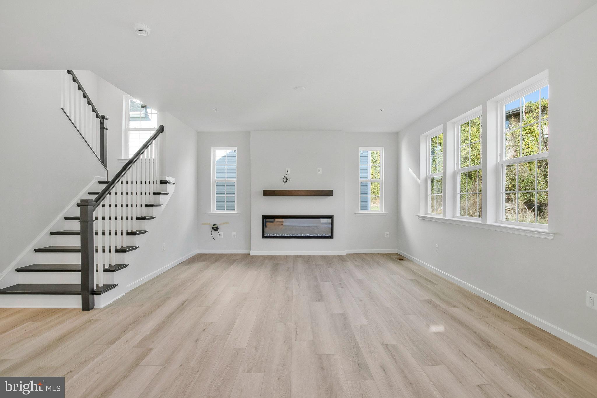 5 Brooks Nolen Way Owings Mills, MD 21117 - Photo 14 of 76 a view of wooden floor and windows in a room