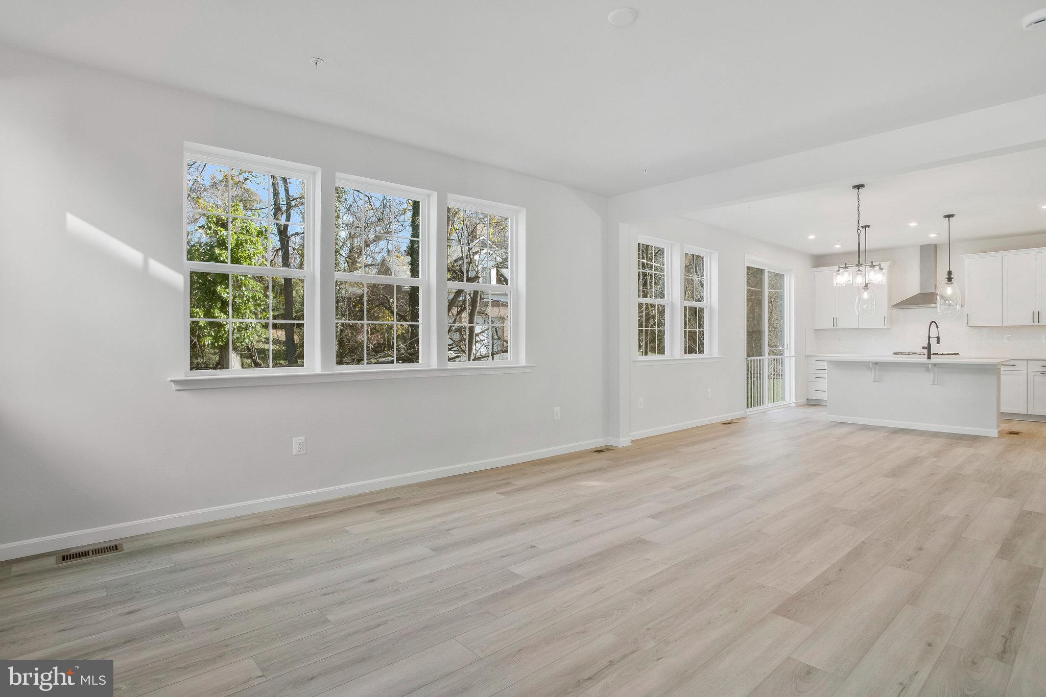 5 Brooks Nolen Way Owings Mills, MD 21117 - Photo 17 of 76 a view of an empty room with a window and wooden floor