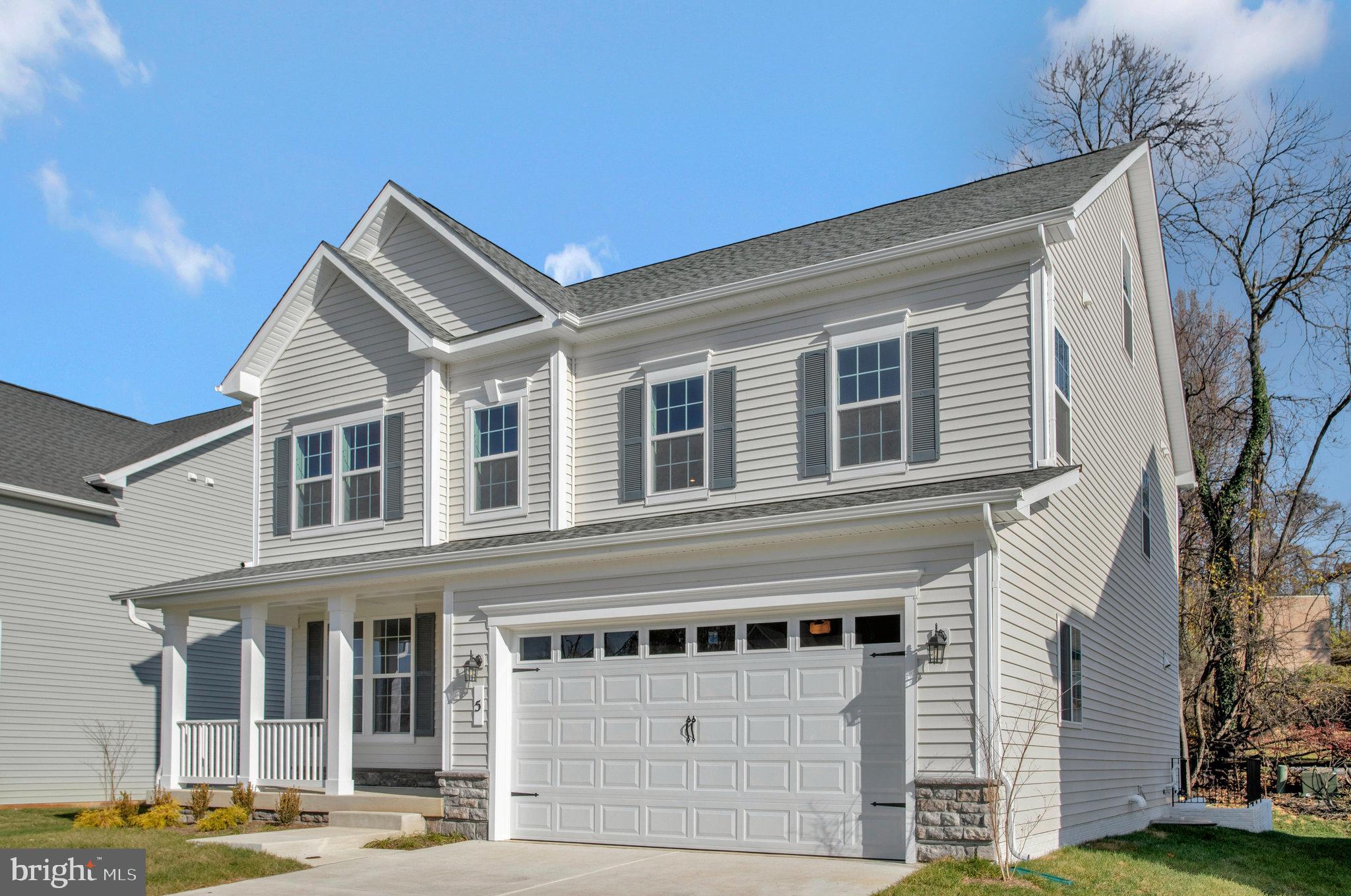 5 Brooks Nolen Way Owings Mills, MD 21117 - Photo 2 of 76 a front view of a house with a yard