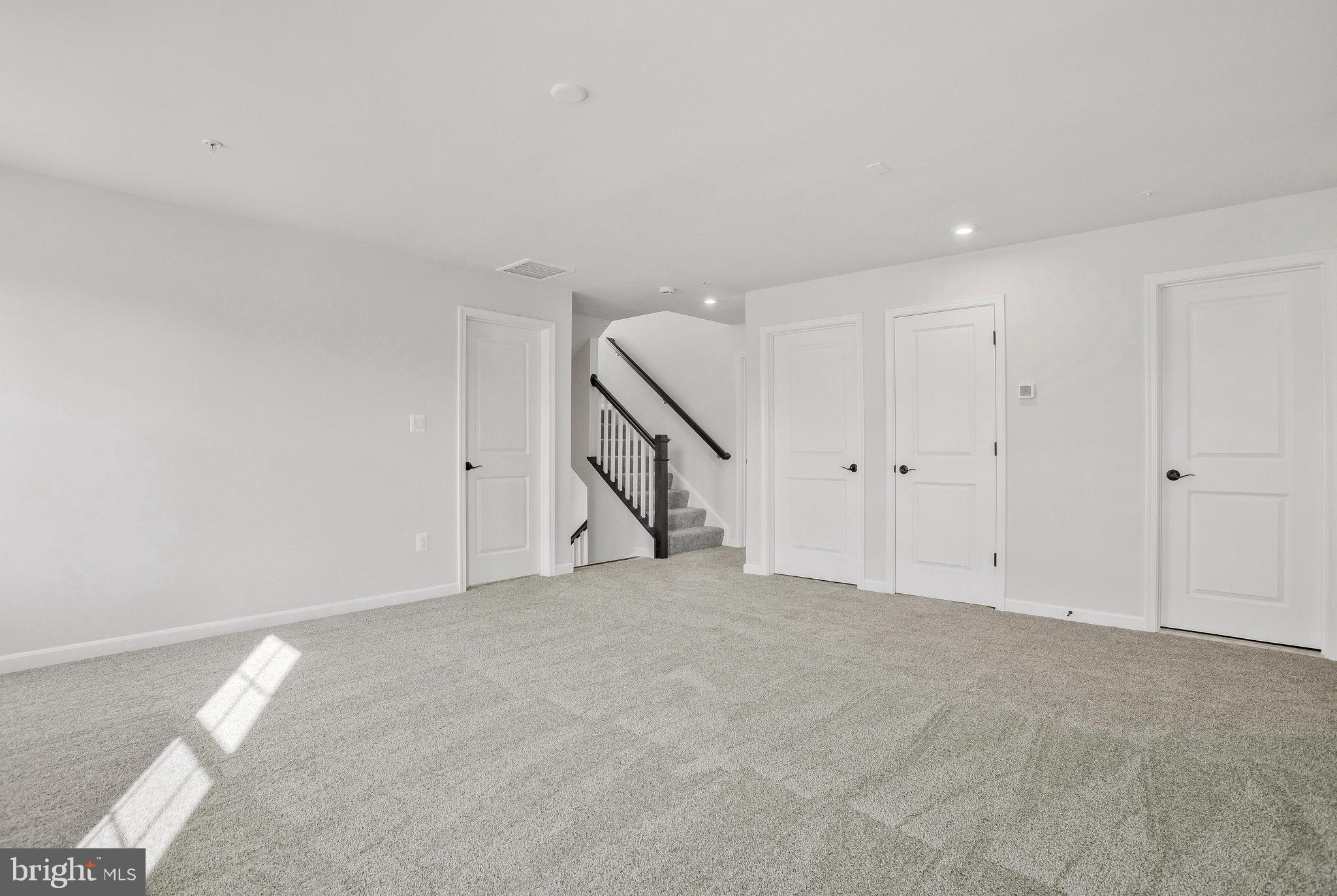 5 Brooks Nolen Way Owings Mills, MD 21117 - Photo 32 of 76 a view of an empty room with stairs