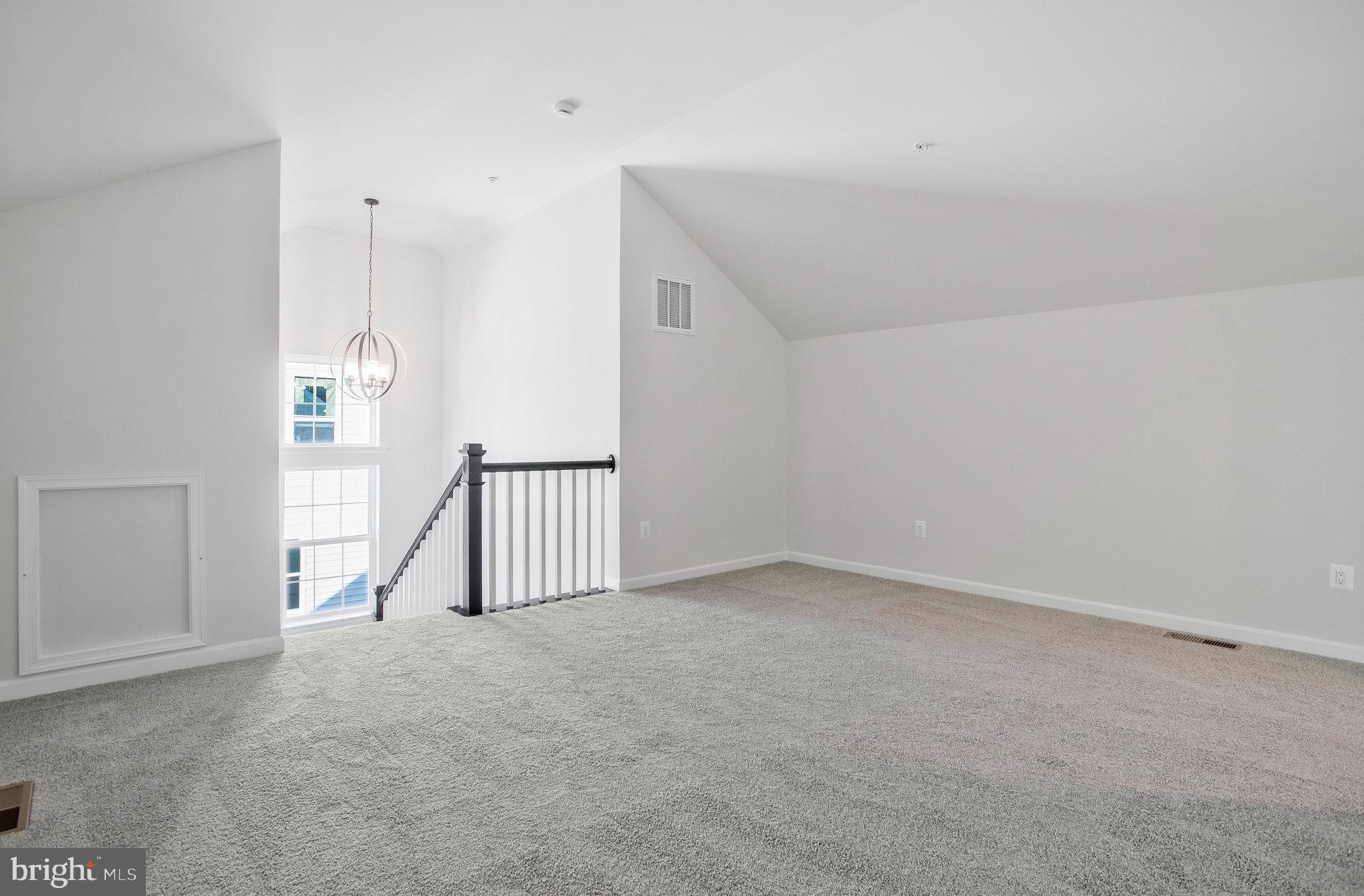 5 Brooks Nolen Way Owings Mills, MD 21117 - Photo 54 of 76 an empty room with a ceiling fan and windows