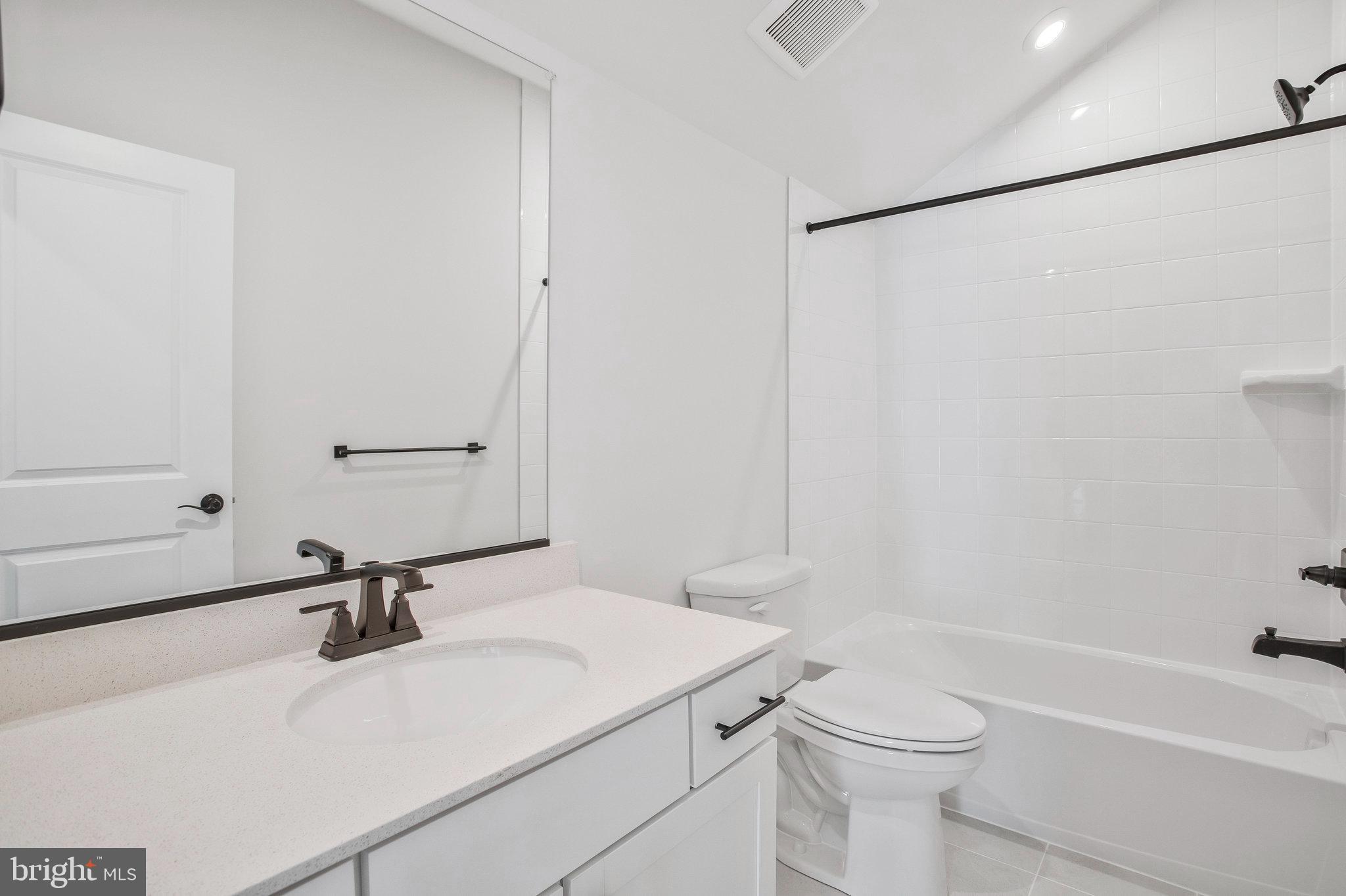 5 Brooks Nolen Way Owings Mills, MD 21117 - Photo 57 of 76 a bathroom with a sink a toilet and a tub