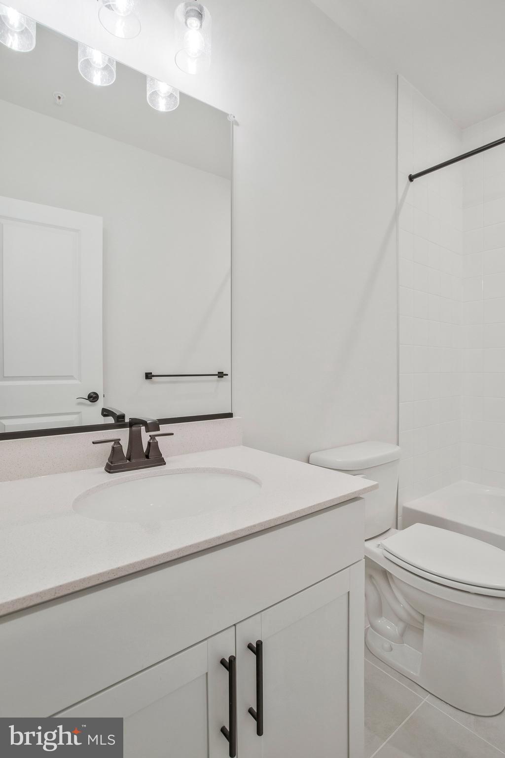 5 Brooks Nolen Way Owings Mills, MD 21117 - Photo 70 of 76 a bathroom with a sink vanity mirror and toilet
