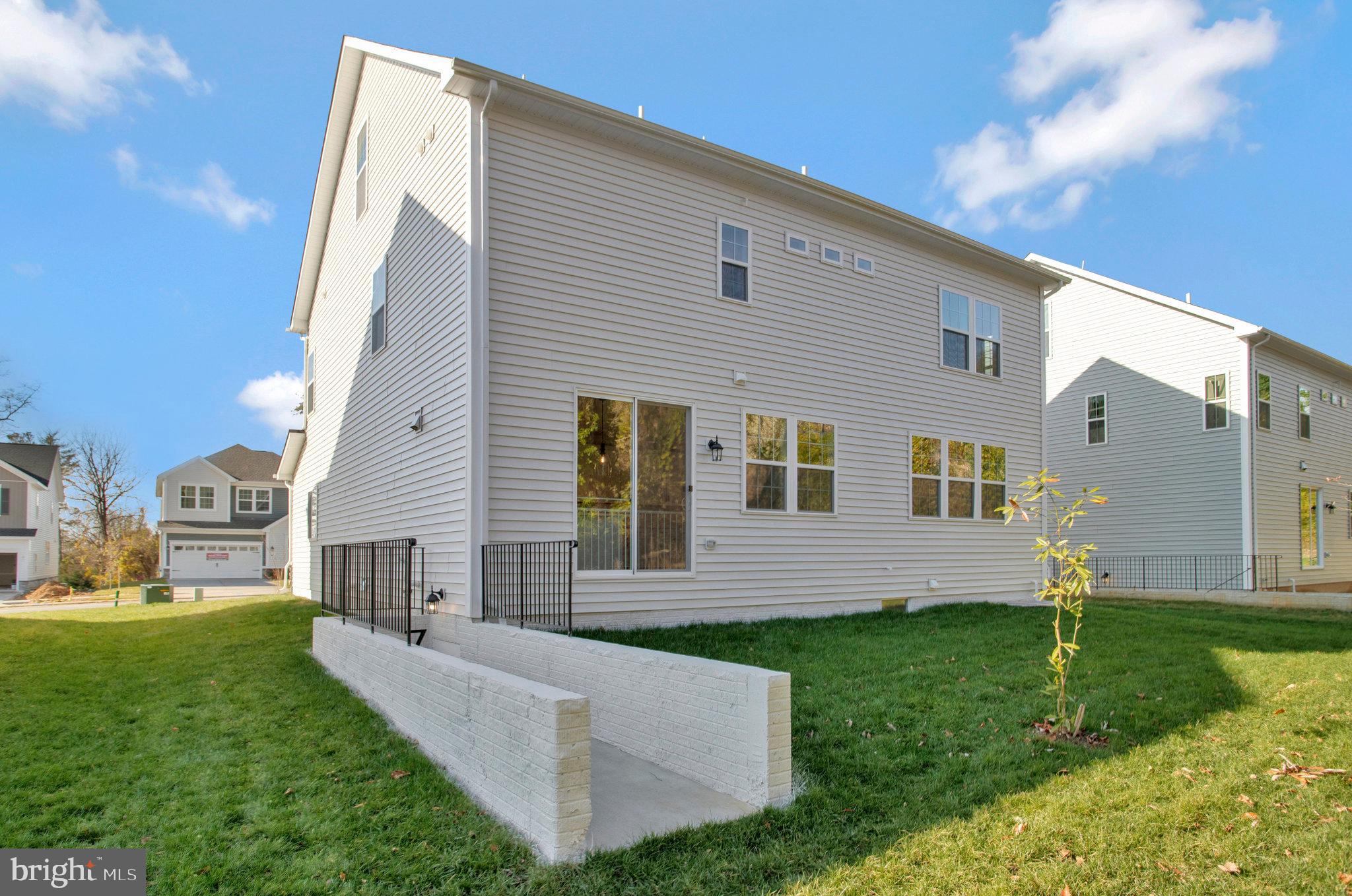 5 Brooks Nolen Way Owings Mills, MD 21117 - Photo 75 of 76 a front view of house with yard and green space