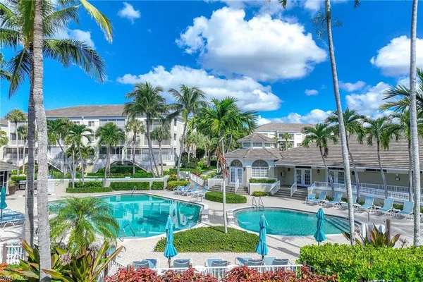 a view of a swimming pool with a patio