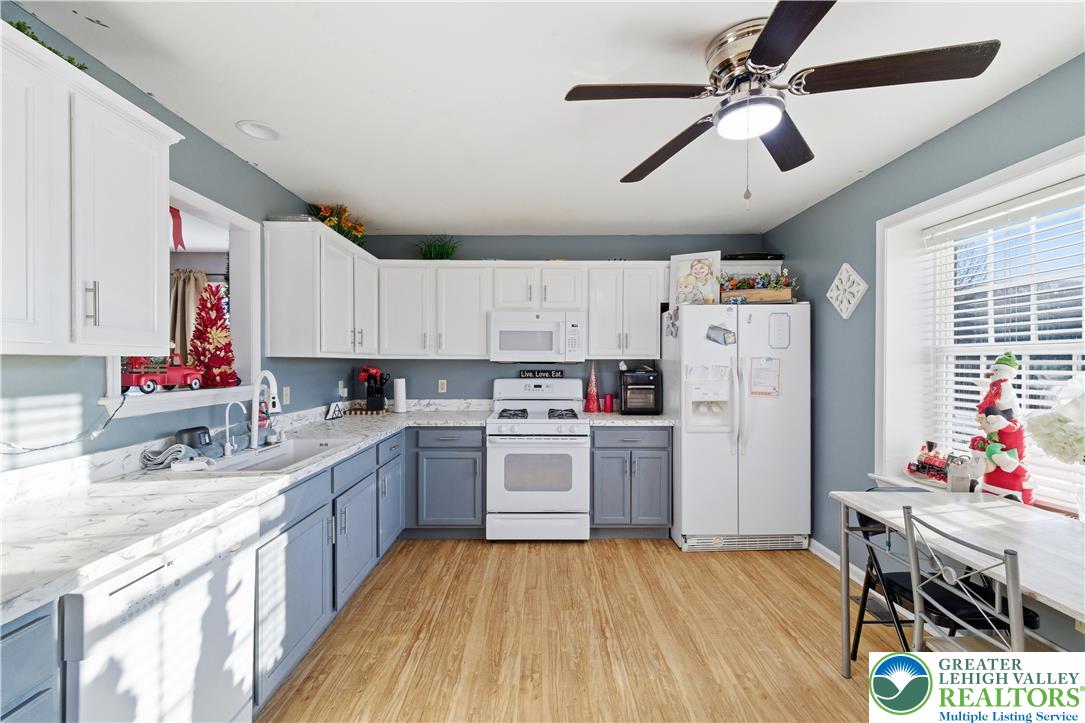 347 South Oak Street Freemansburg, PA 18017 - Photo 8 of 44 a kitchen with cabinets wooden floor and stainless steel appliances