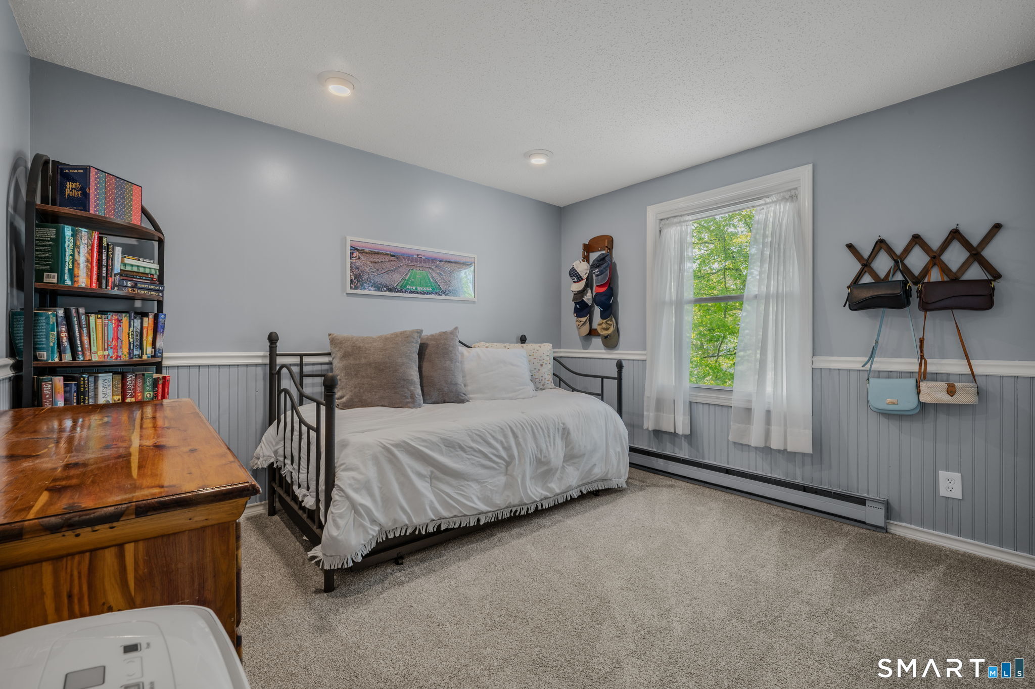 6 Amherst Court Groton, CT 06355 - Photo 19 of 40 a spacious bedroom with a bed a book shelf and a window
