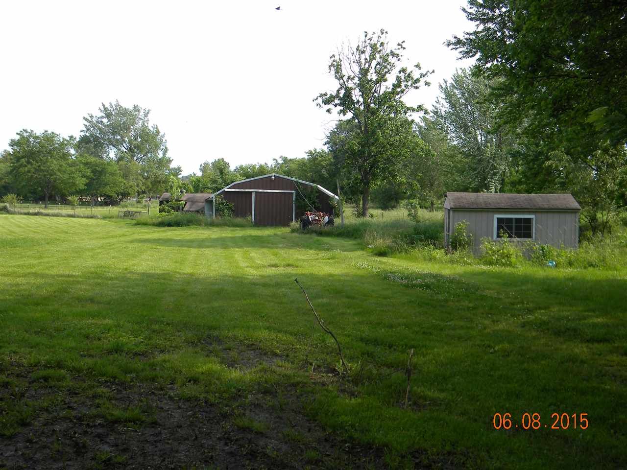 8105 Huber Road Belvidere, IL 61008 - Photo 3 of 20 a backyard of a house with table and chairs