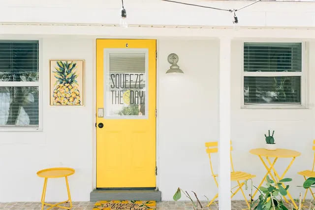 a view of a bedroom with furniture and a window