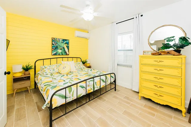 a bedroom with a bed and a dresser