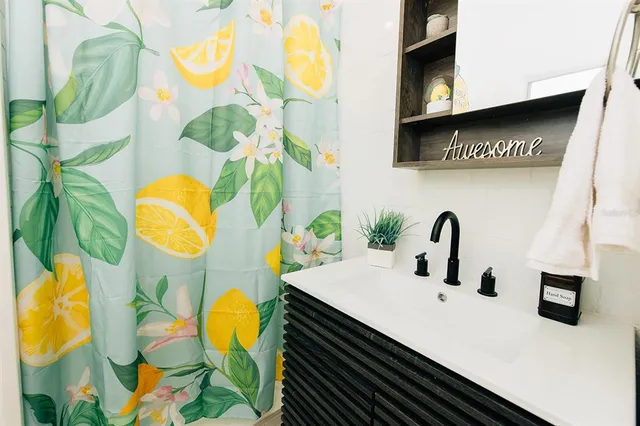 a bathroom with a sink and a mirror