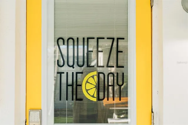 a view of front door of yellow house