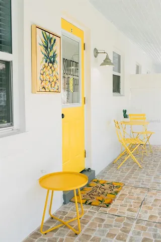 a bedroom with a table and a chair