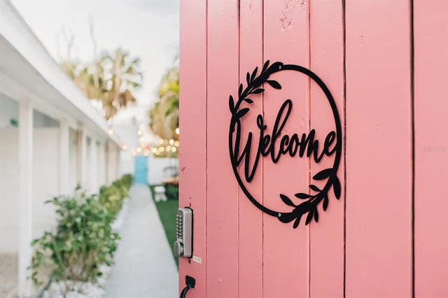 a sign on a wall in front of a building