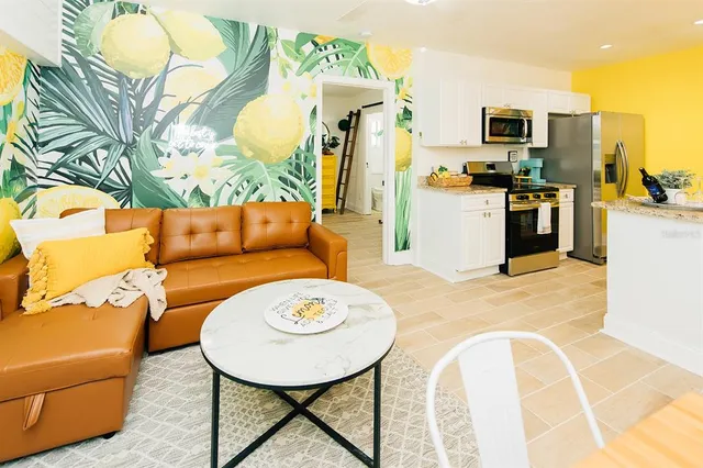a living room with fireplace furniture and a flat screen tv