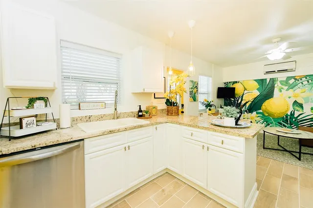 a kitchen with a sink stove and cabinets