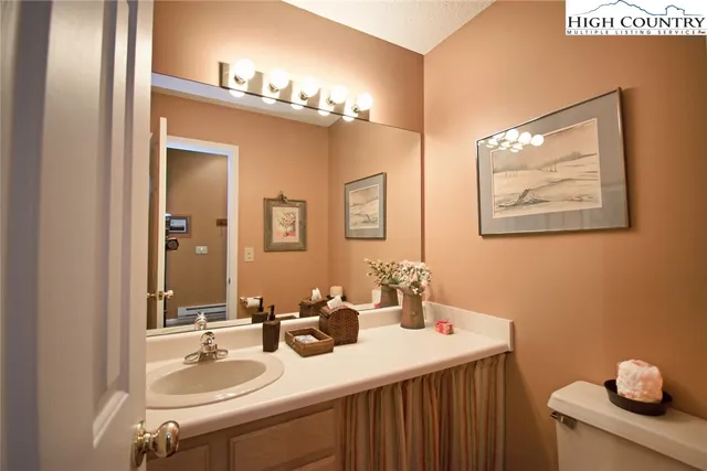 a bathroom with a sink double vanity and a mirror