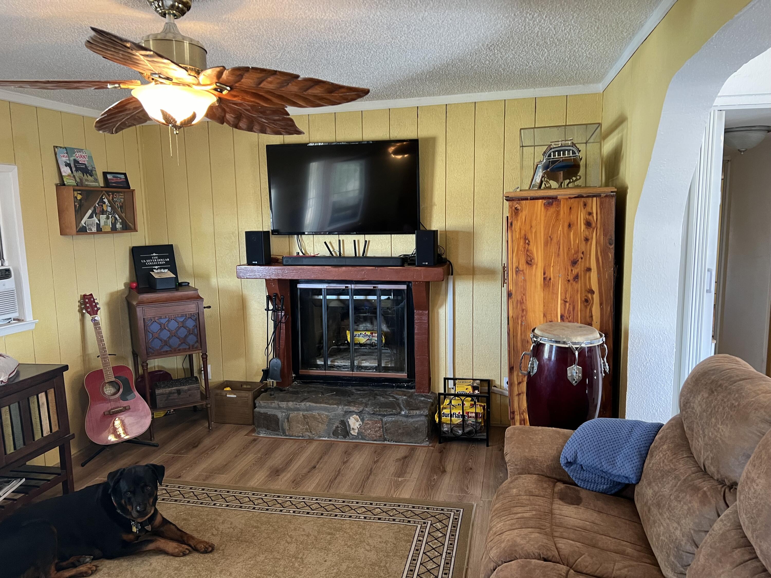 101751 Parkside Drive Mecca, CA 92254 - Photo 22 of 45 a living room with furniture a flat screen tv and a fireplace