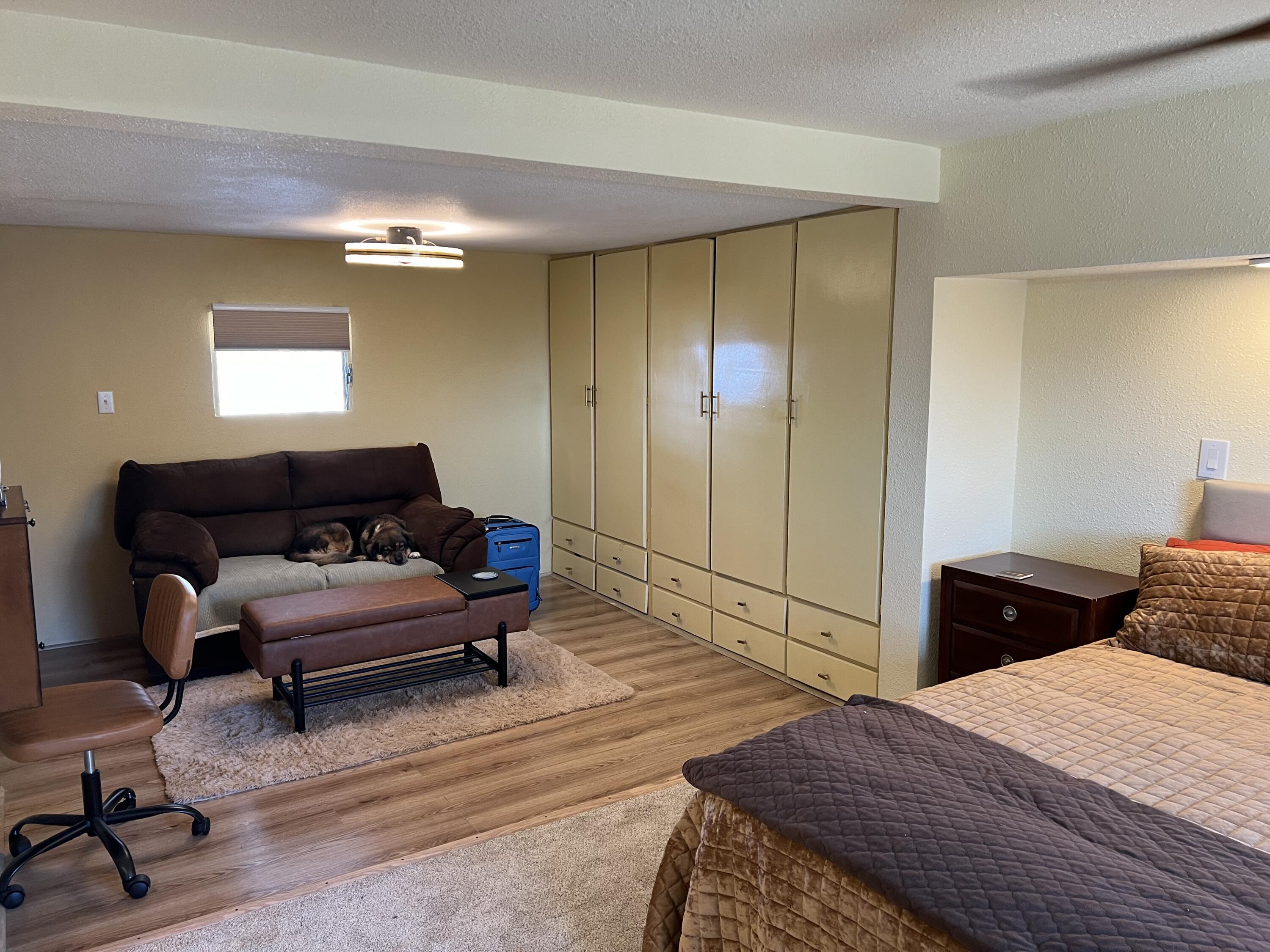 101751 Parkside Drive Mecca, CA 92254 - Photo 28 of 45 a bedroom with furniture and a wooden floor