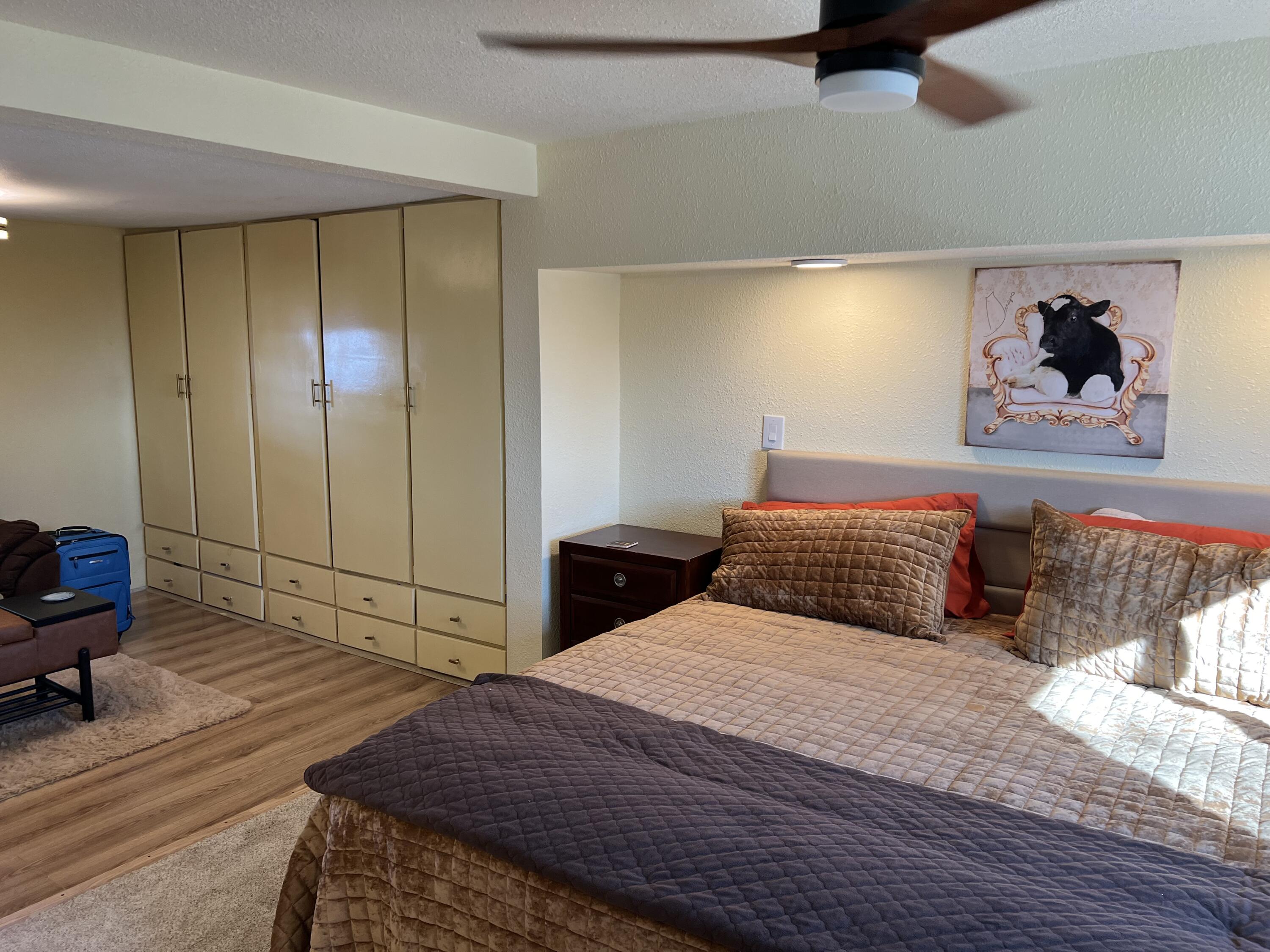 101751 Parkside Drive Mecca, CA 92254 - Photo 29 of 45 a bedroom with a bed and a painting on the wall