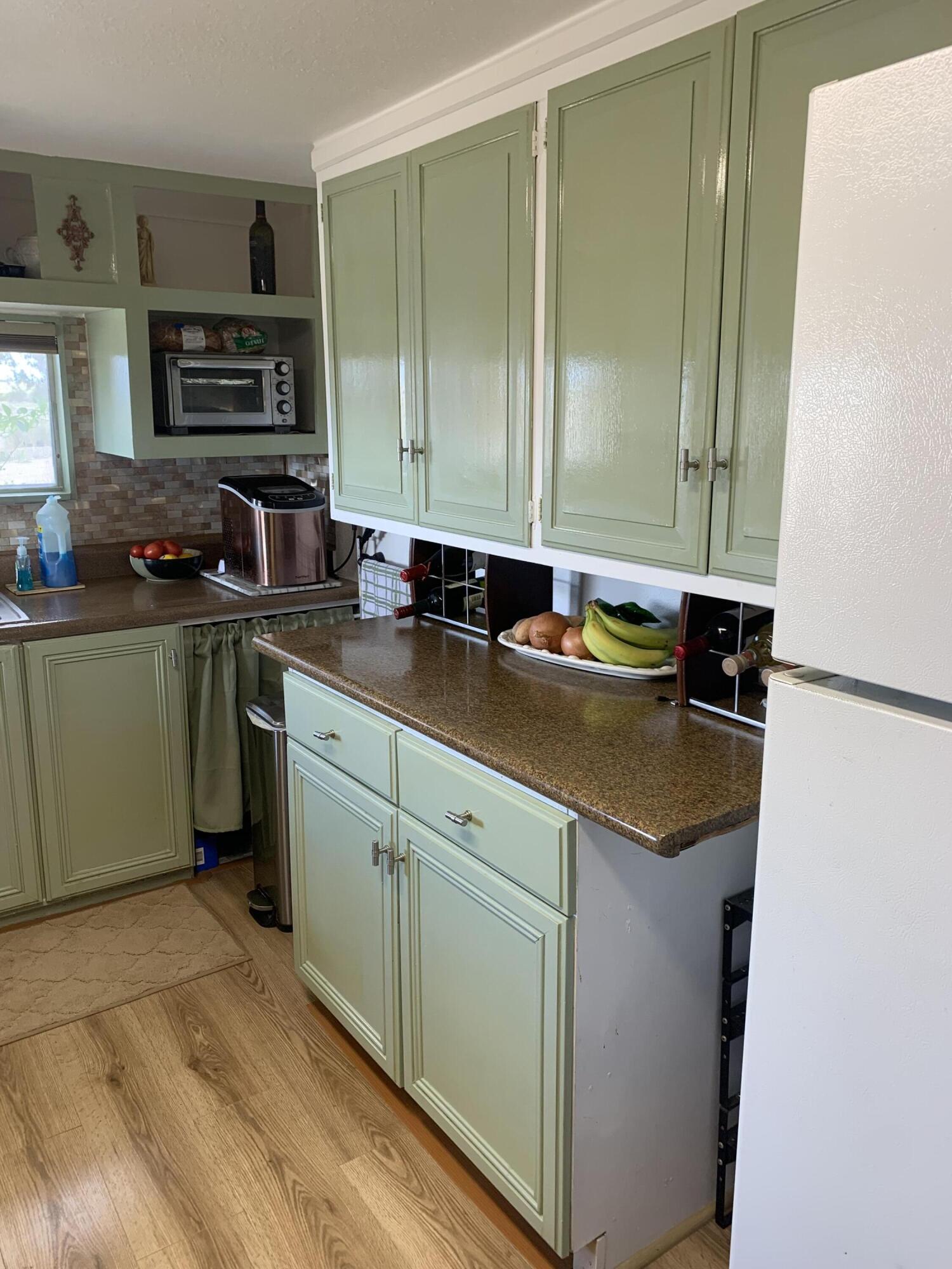 101751 Parkside Drive Mecca, CA 92254 - Photo 10 of 45 a kitchen with stainless steel appliances granite countertop a sink stove and cabinets
