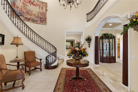 a view of a hallway with living room and furniture