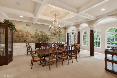 a large kitchen with a table and chairs